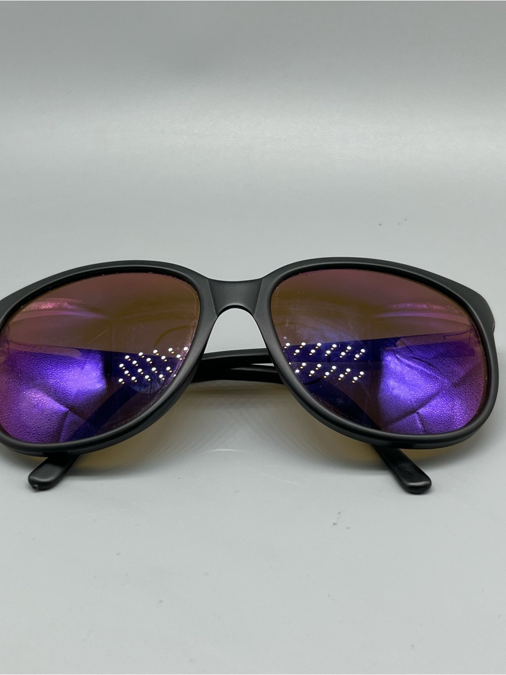 Revo Matte Black Sunglasses with Purple Mirrored Lenses